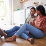 Couple communication, love with coffee in the kitchen and happy together to bond in the morning. Ma